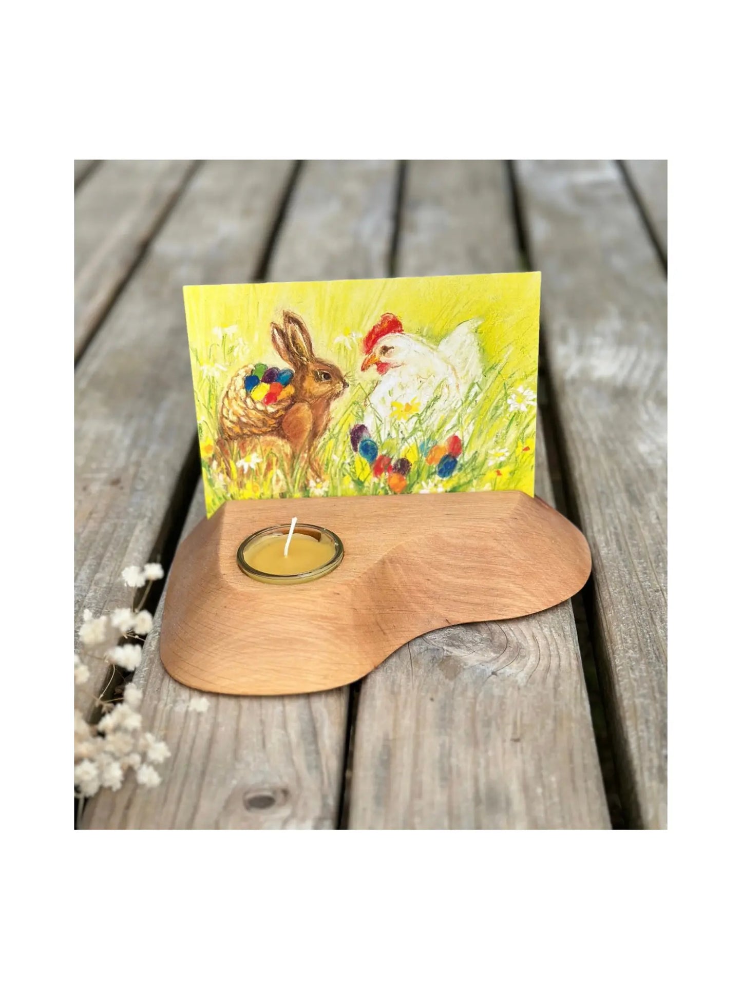 Alderwood Photo and Postcard Holder with Tealight and a postcard of Easter bunny and hen on rustic outdoor wooden table