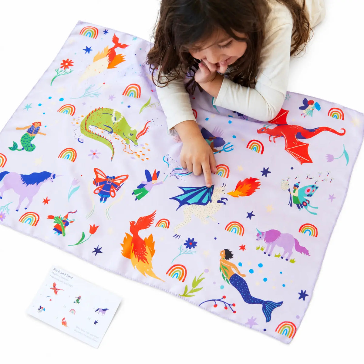 Girl playing with Magical Creatures Seek and Find Playsilk
