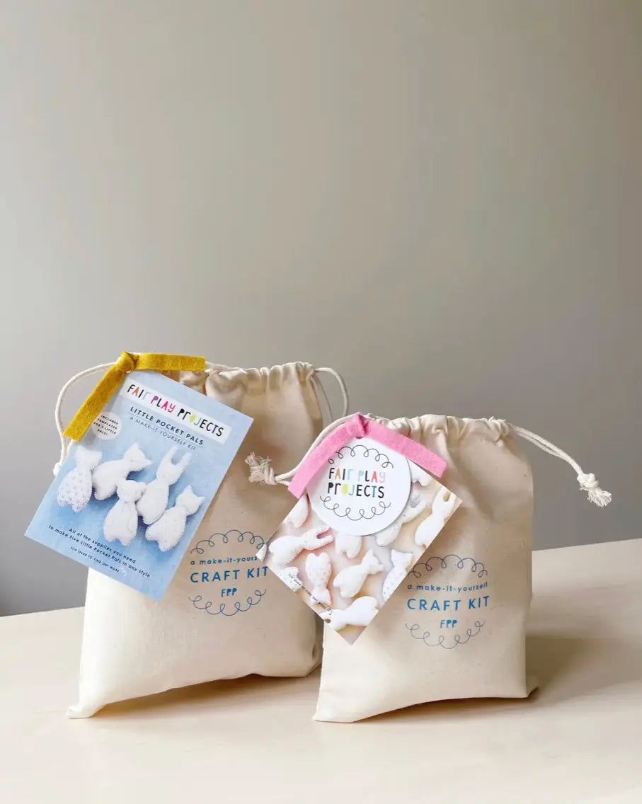 Craft kit with bunny shapes and packaging on a neutral background
