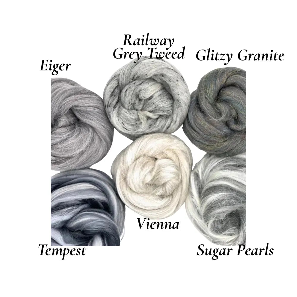 Collection of luxury wool skeins labeled with names on a white background