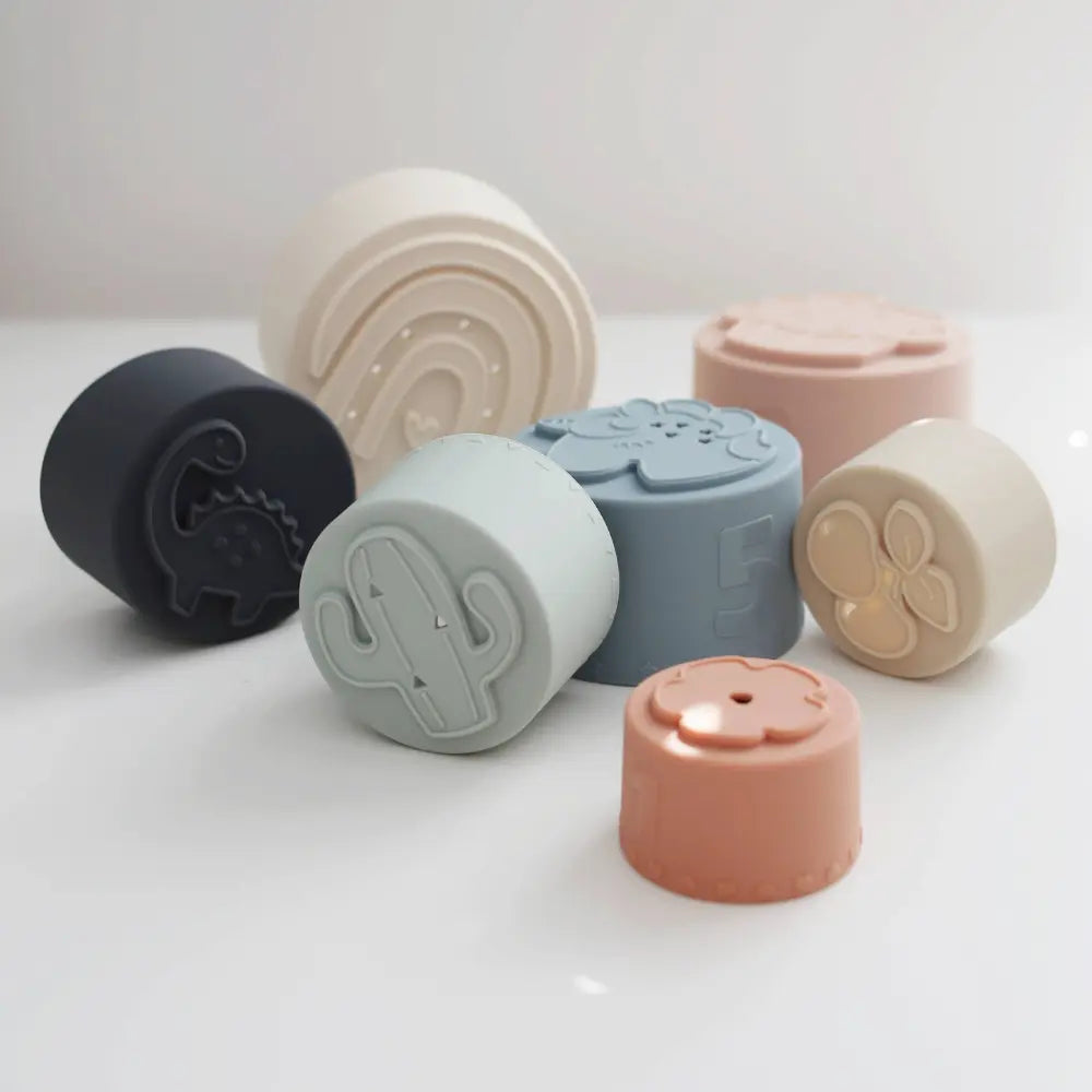 Set of silicone stacking cups with patterned bottoms