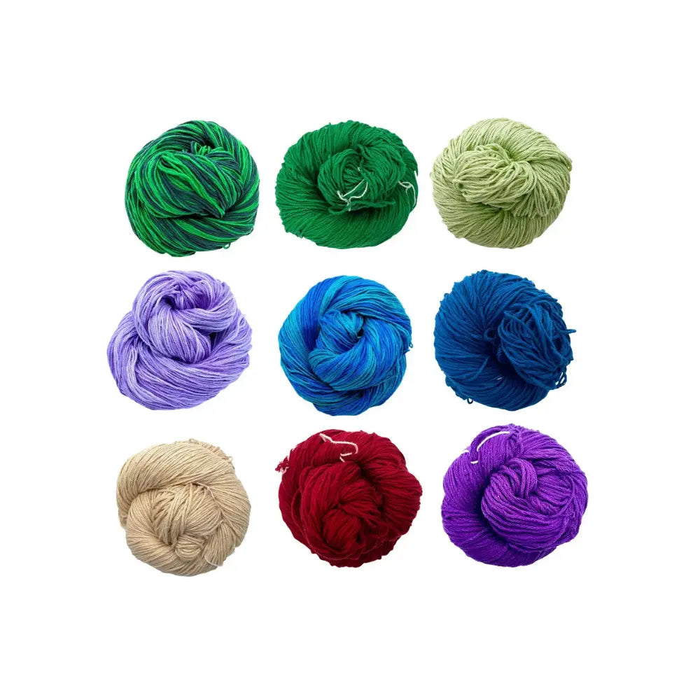 Nine skeins of Mulberry Silk Fingering Weight yarn in various colors on a white background