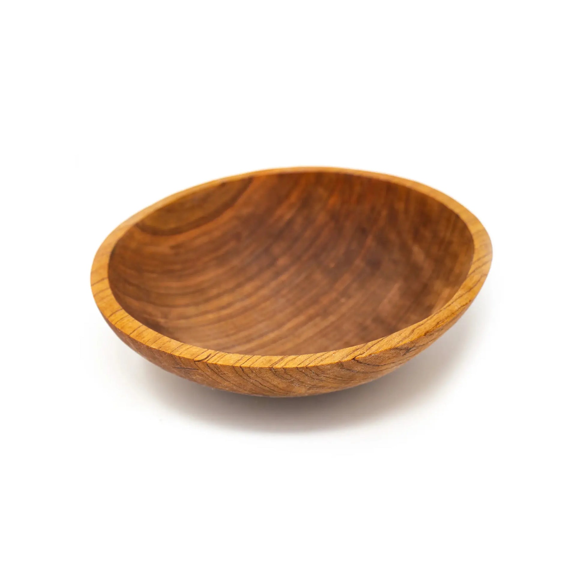 Wooden hand carved bowl on a white background