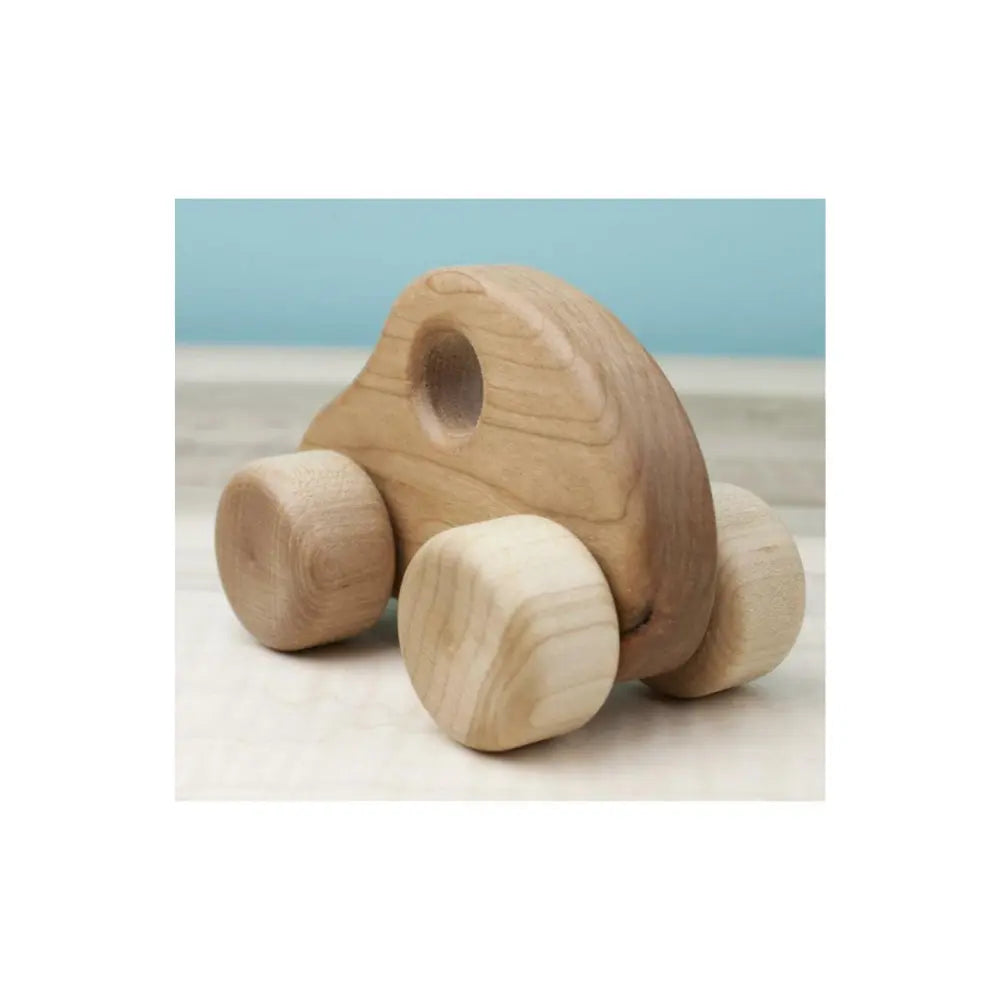 Small wooden toy car with rounded body and natural wood wheels