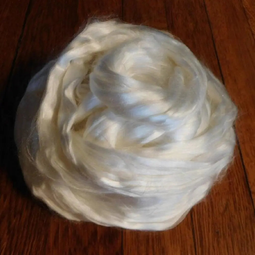 mulberry silk fiber combed silk top for spinning and blending on wooden background
