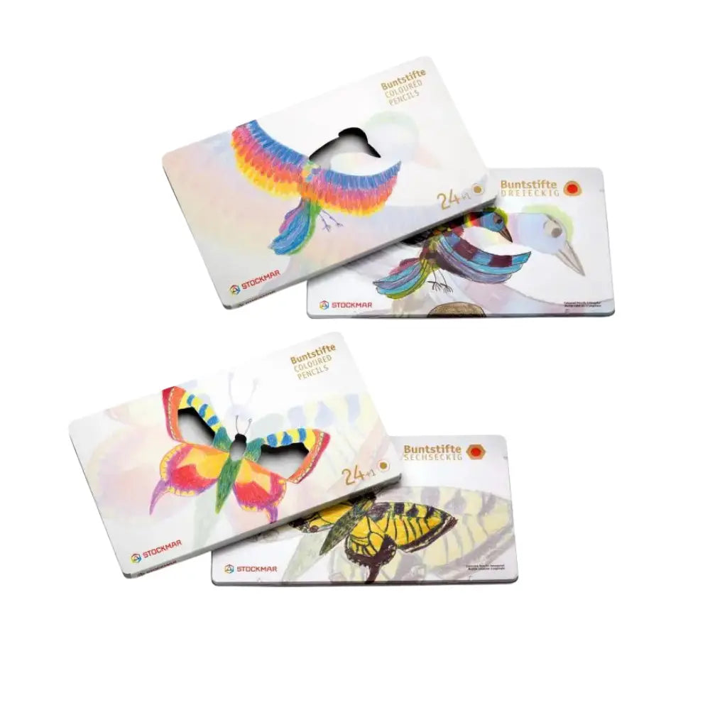 Triangular and hexagonal Stockmar colored pencil sets with bird and butterflies on metal tins
