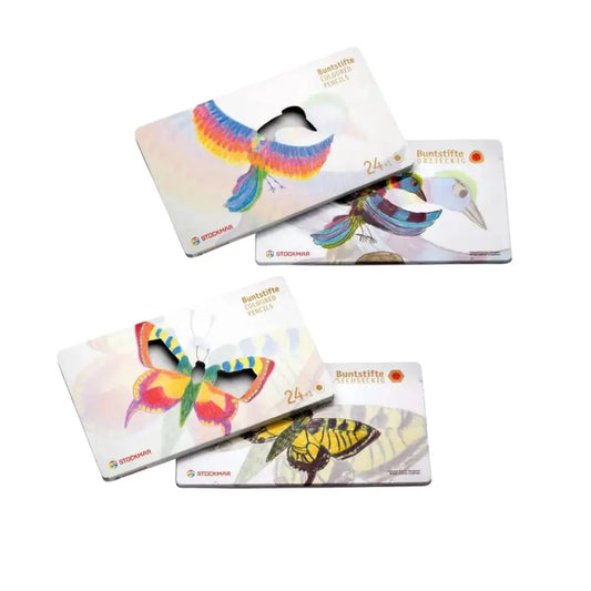 Triangular and hexagonal Stockmar colored pencil sets with bird and butterflies on metal tins