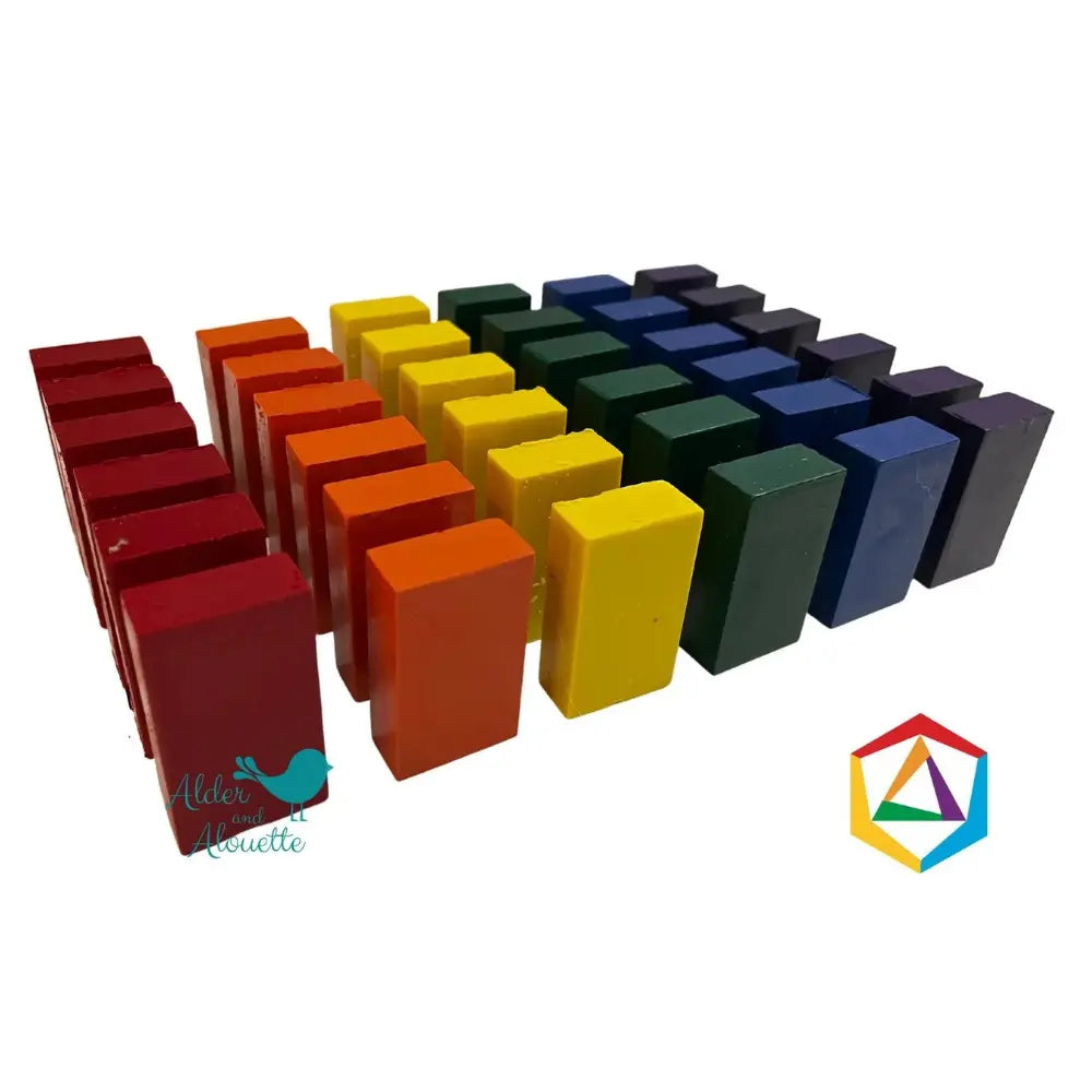 Set of colorful block crayons on a white background with the Stockmar logo