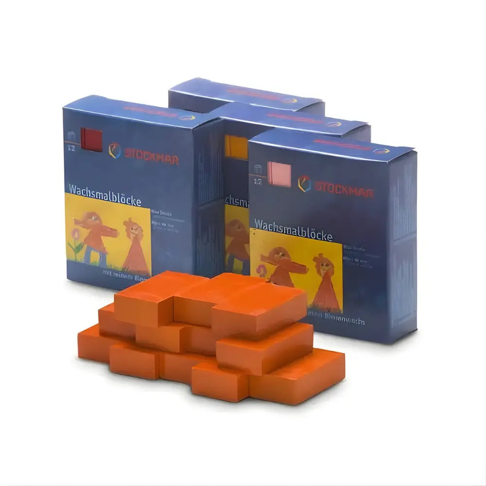 Orange wax crayon blocks with blue packaging on a white background