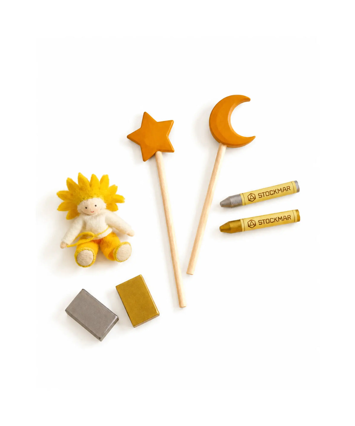A sun fairy with a moon and star wooden wand set and gold and silver Stockmar crayon set