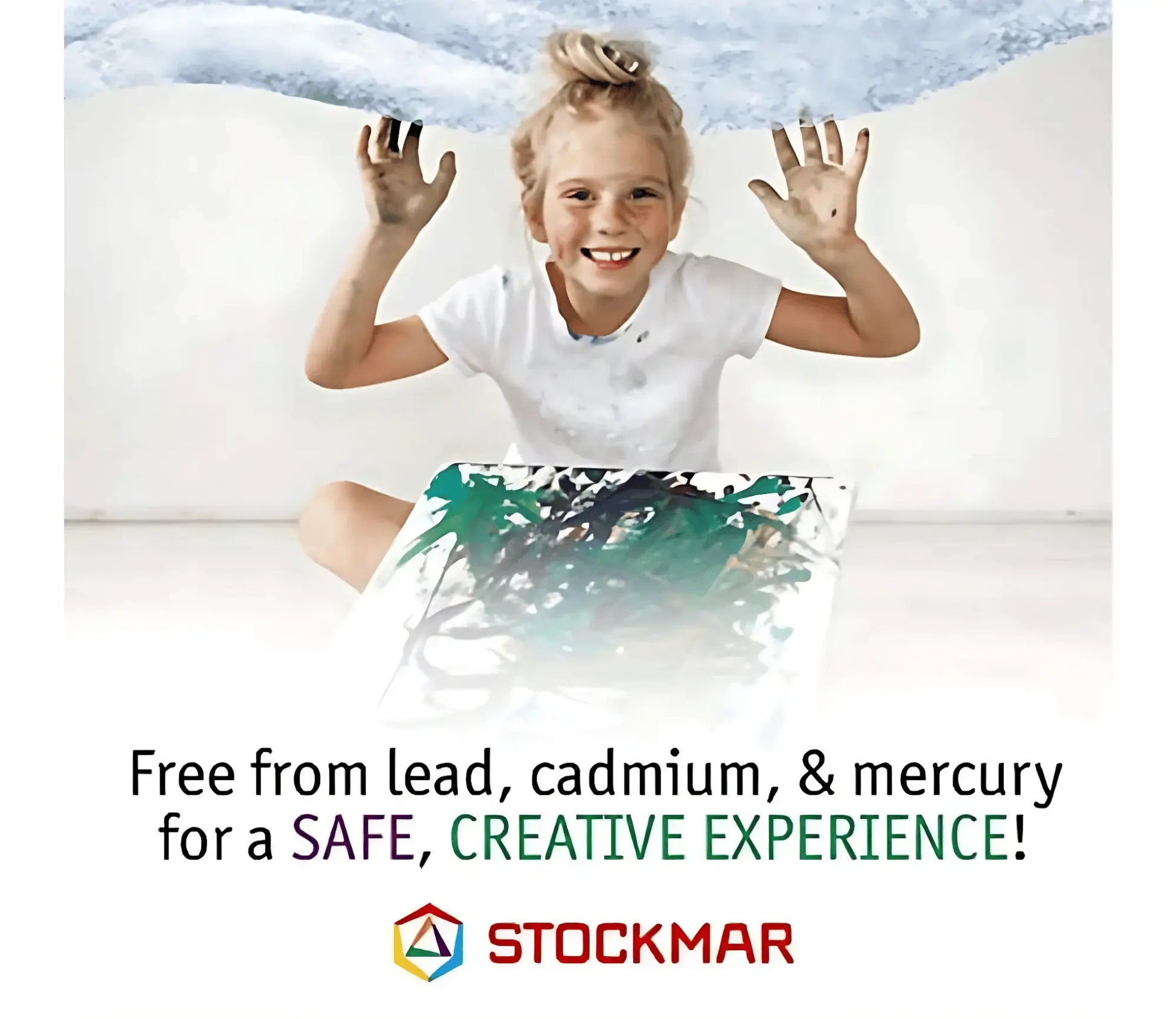 Girl holding up hands with Stockmar painting text free from lead, cadmium, and mercury