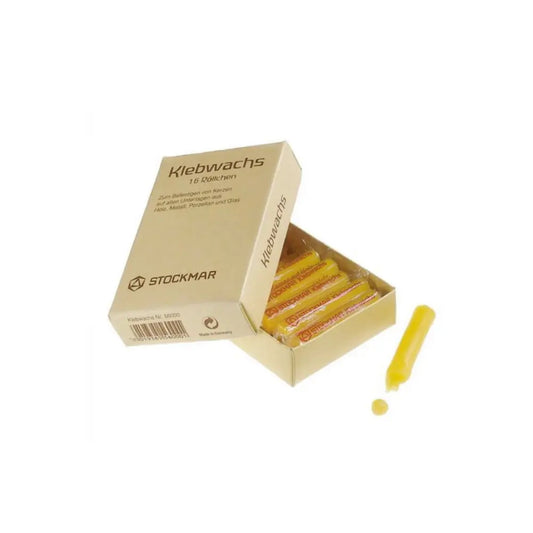 Box of Stockmar Klebwachs with a single stick on a white background