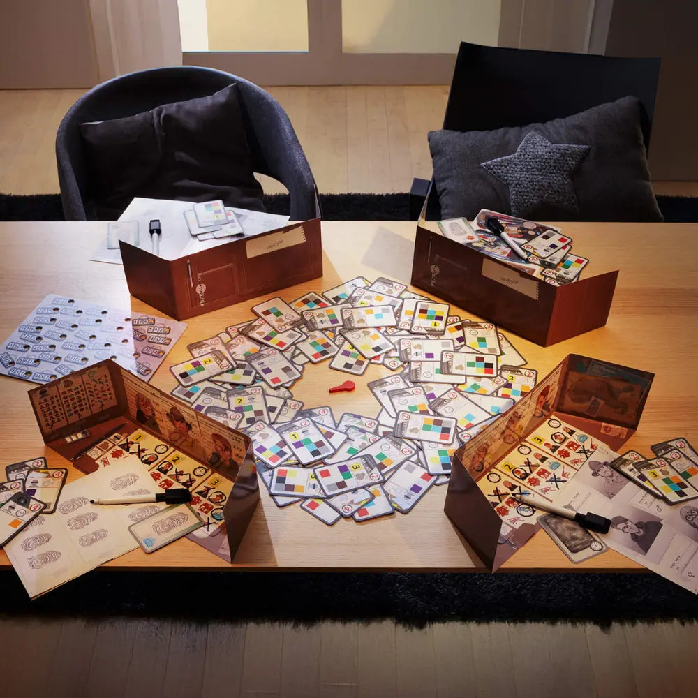 Board game with cards and pieces on a table in a room.