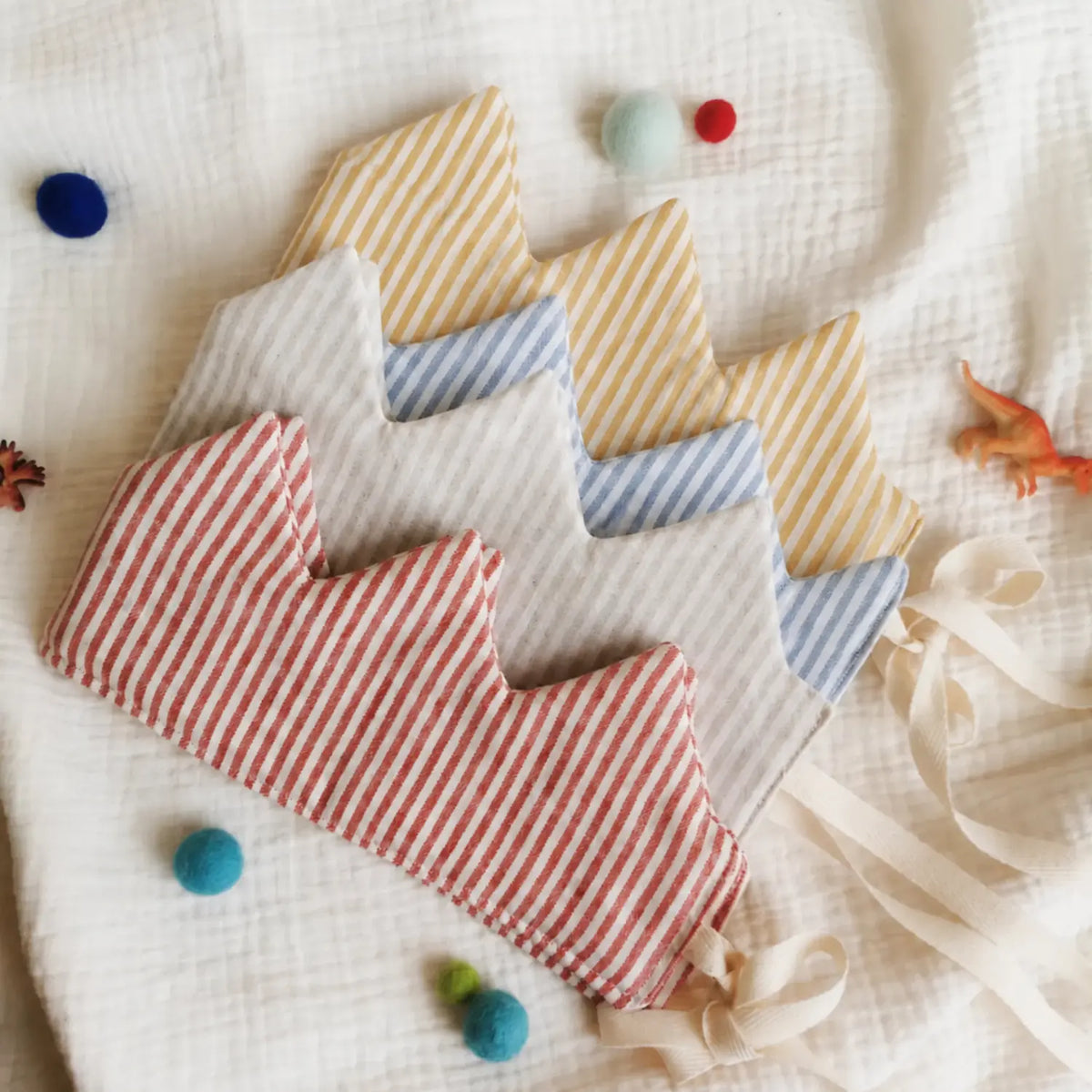 Striped linen crown collection in red, beige, blue, and golden mustard