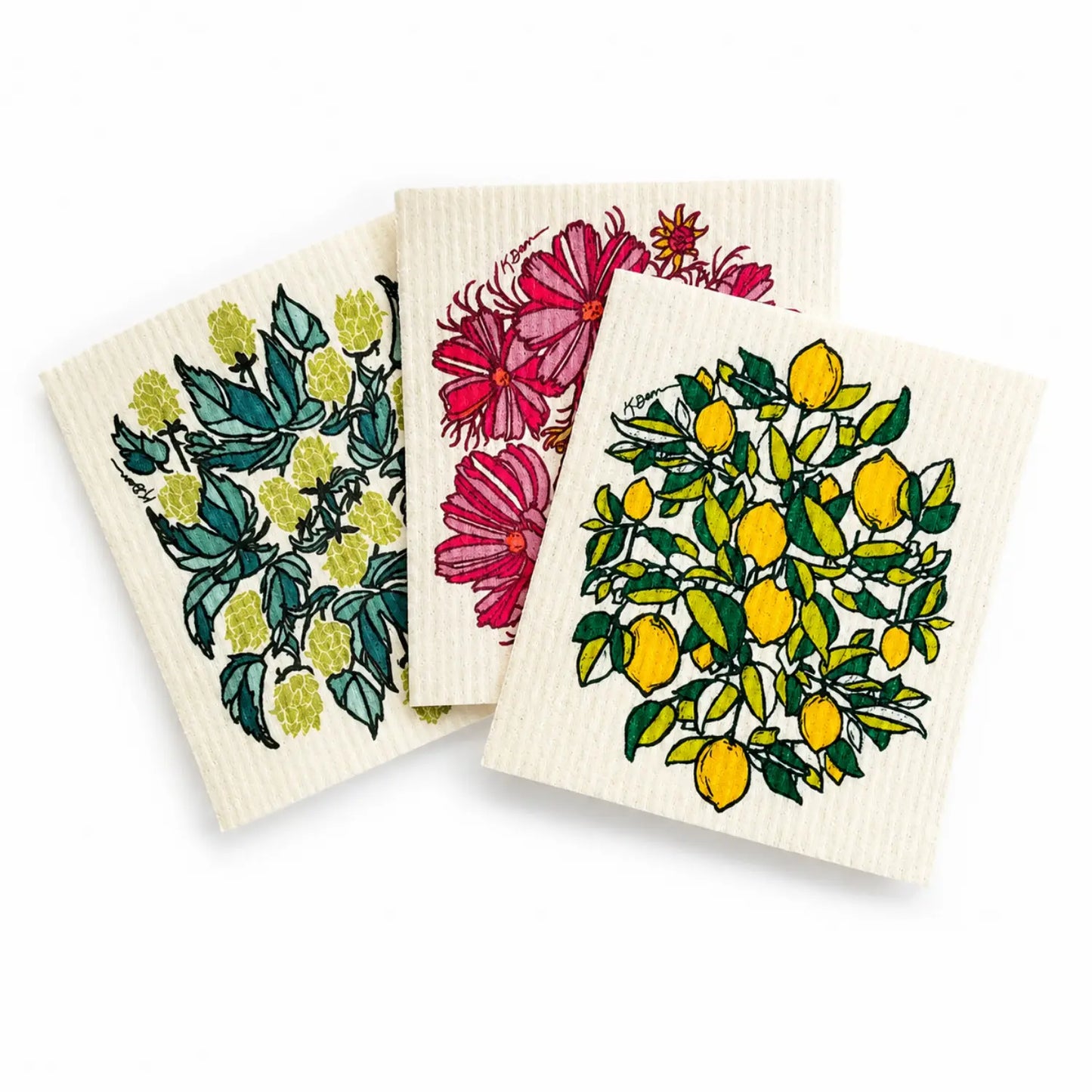 Three reusable Swedish dishcloths with hops, cosmos flower, and lemon designs