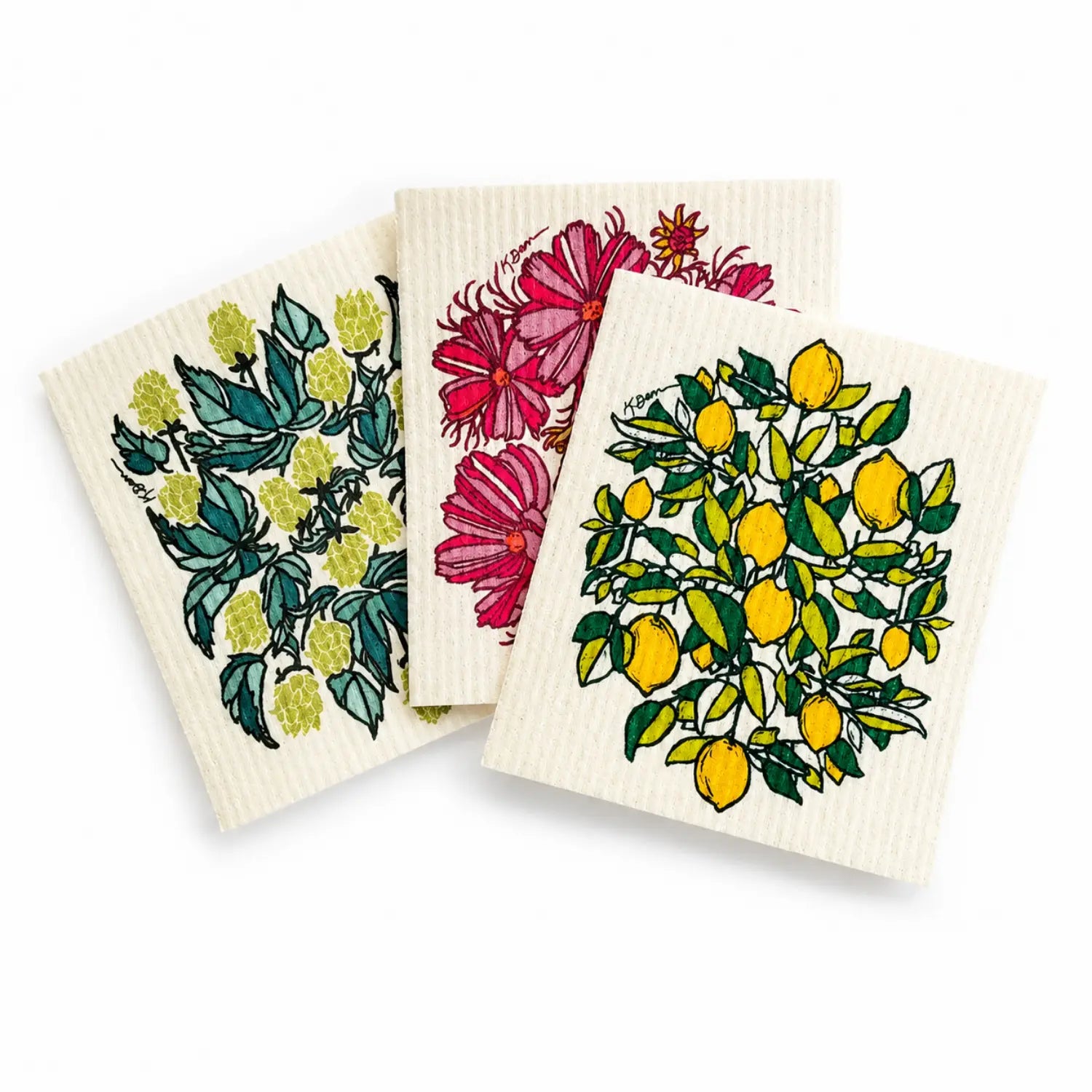 Three reusable Swedish dishcloths with hops, cosmos flower, and lemon designs