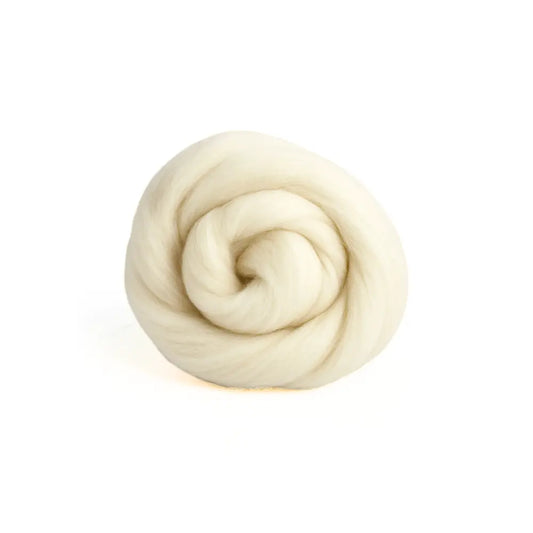 Coiled beige targhee wool on a white background