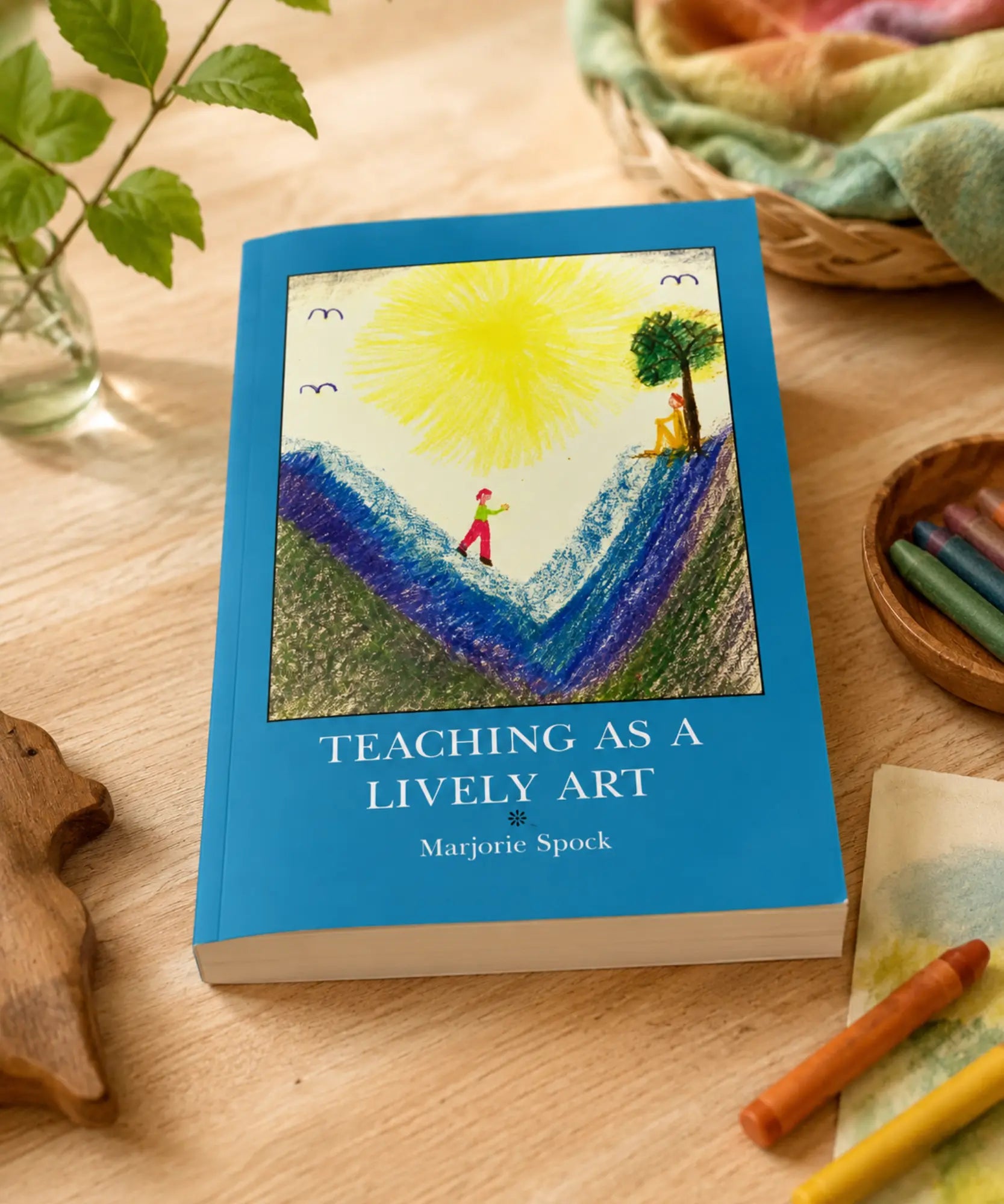 Teaching as a Lively Art waldorf education book on a tabletop with crayons and wooden toys