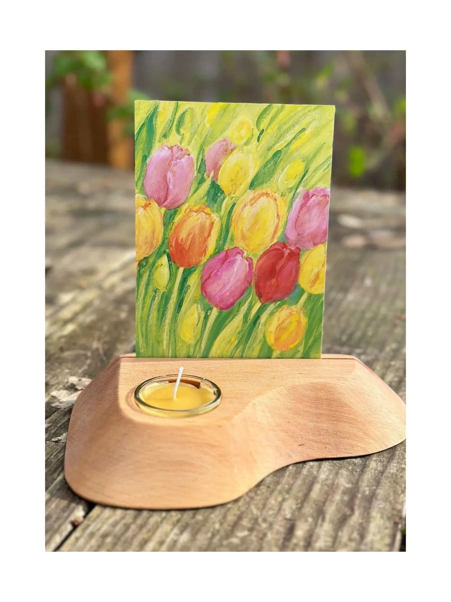 Alderwood Photo and Postcard Holder with Tealight and a postcard of tulips on rustic outdoor wooden table