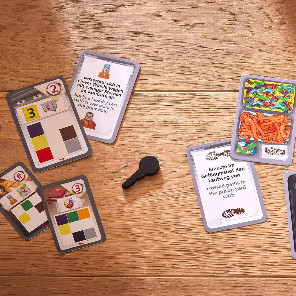Close-up of clue cards from The Key Escape from Strongwall Prison game