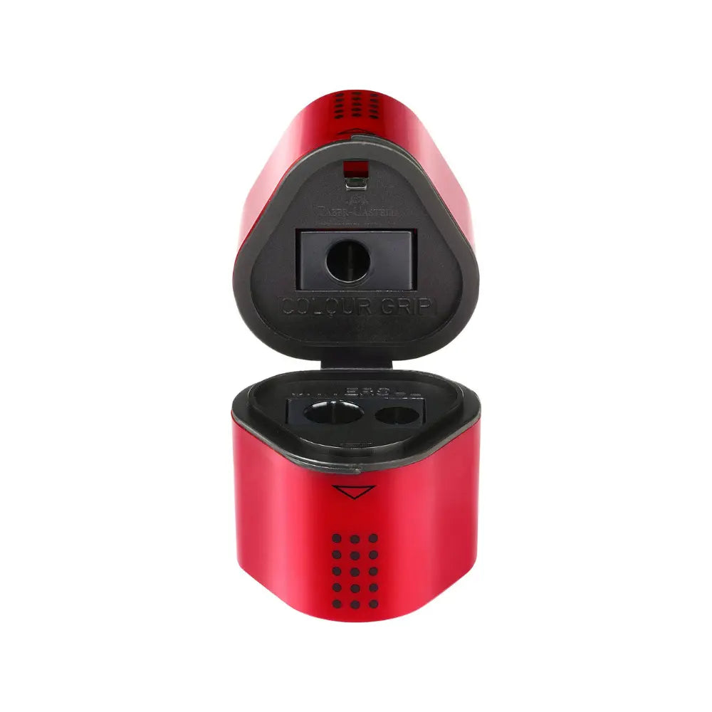 Red three-hole pencil sharpener with open lid and shaving container for standard, thick, graphite, and colored pencils