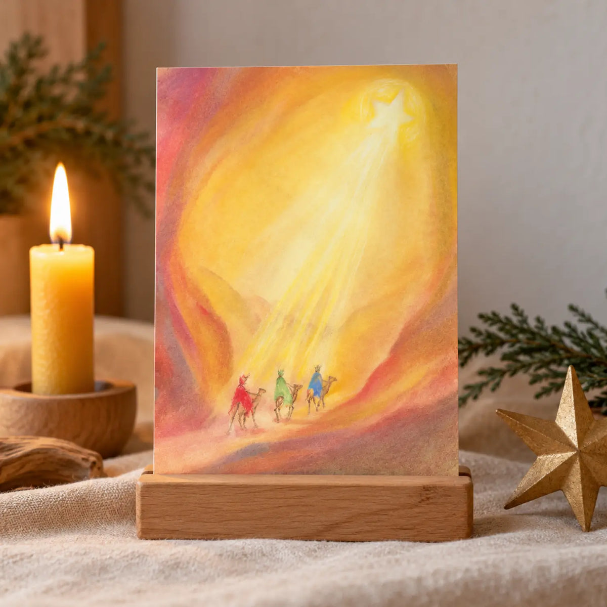 Lifestyle image of tThree Kings postcard by Marjan van Zeyl showing three kings riding camels under a star