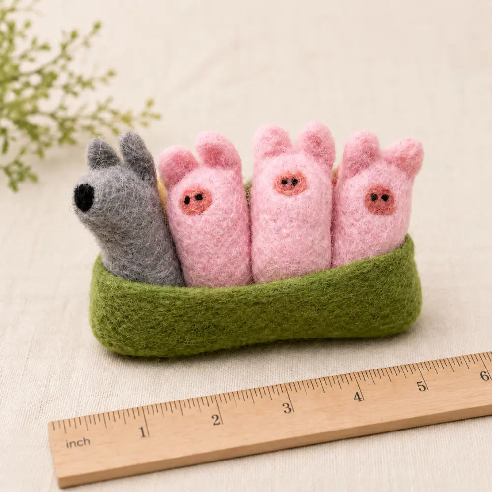 Three Little Pigs felt pocket play set shown with an inch ruler to show the approximately 5 inch size.