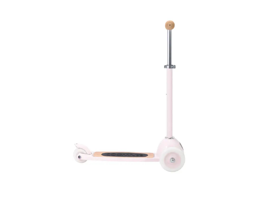 Pink scooter with wooden handle on a white background