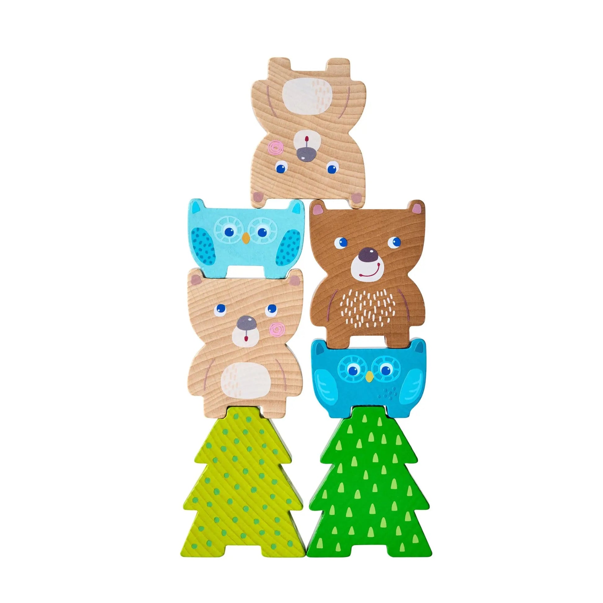 Stack of wooden animal toys with trees on a white background