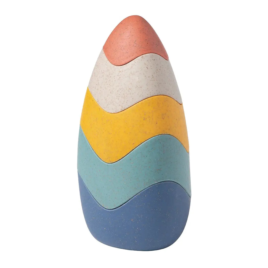 Colorful striped wheatgrass bio toy on a white background