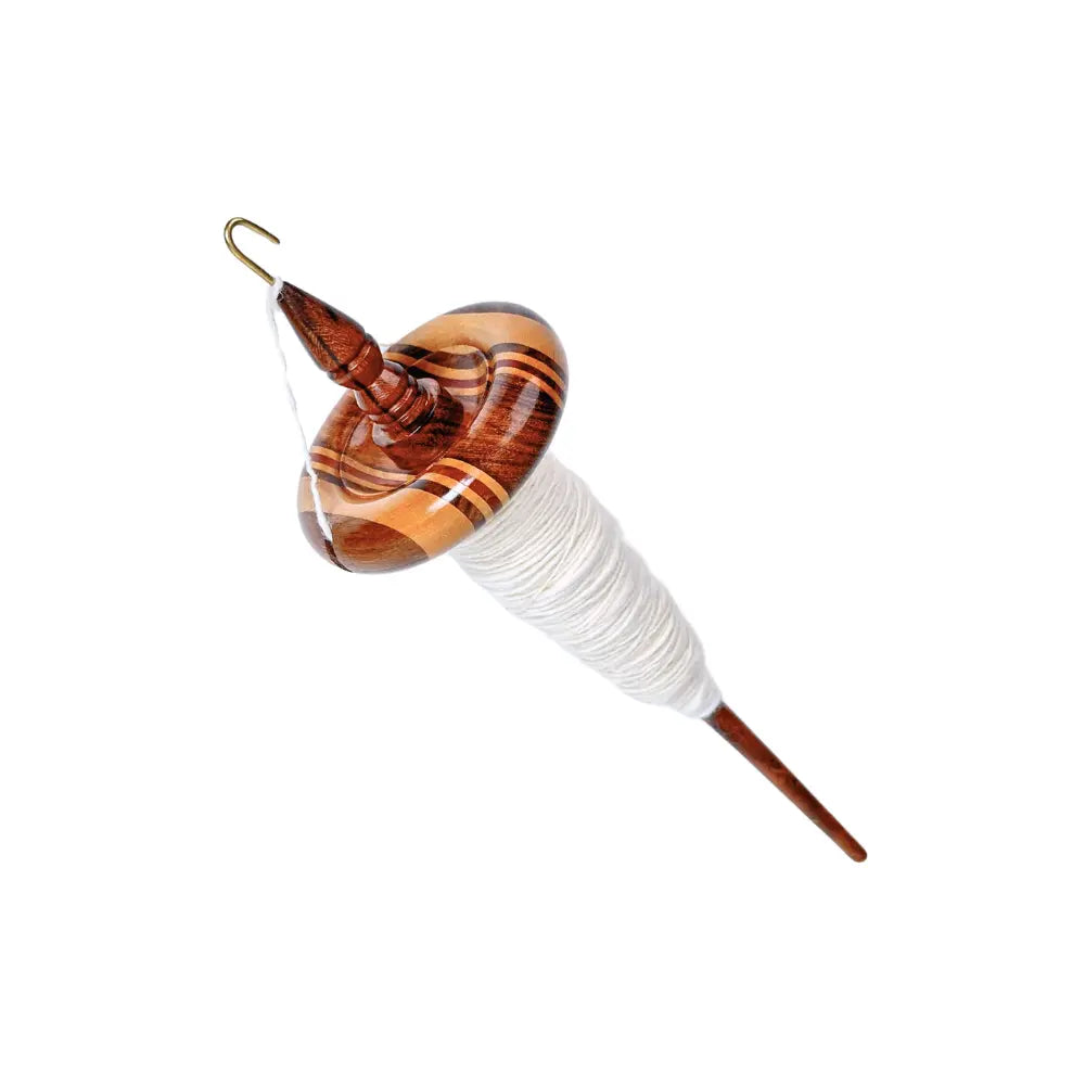 Wooden top whorl drop spindle with white yarn on a white background