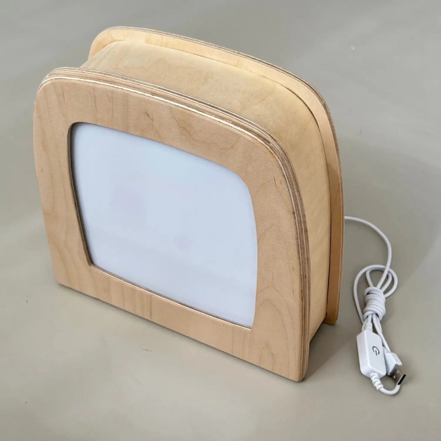 Toverlux Lamp side view with plain frosted panel and natural wood frame with usb plug