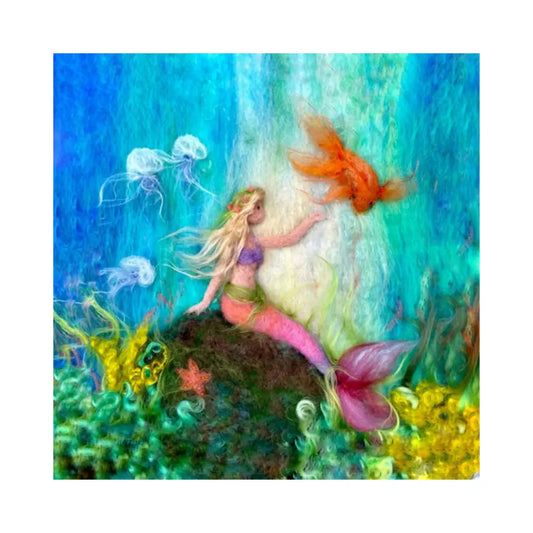 Underwater Toverlux lamp scene of mermaid with pink tail sitting on rock with jellyfish, fish, starfish, and kelp all around her.