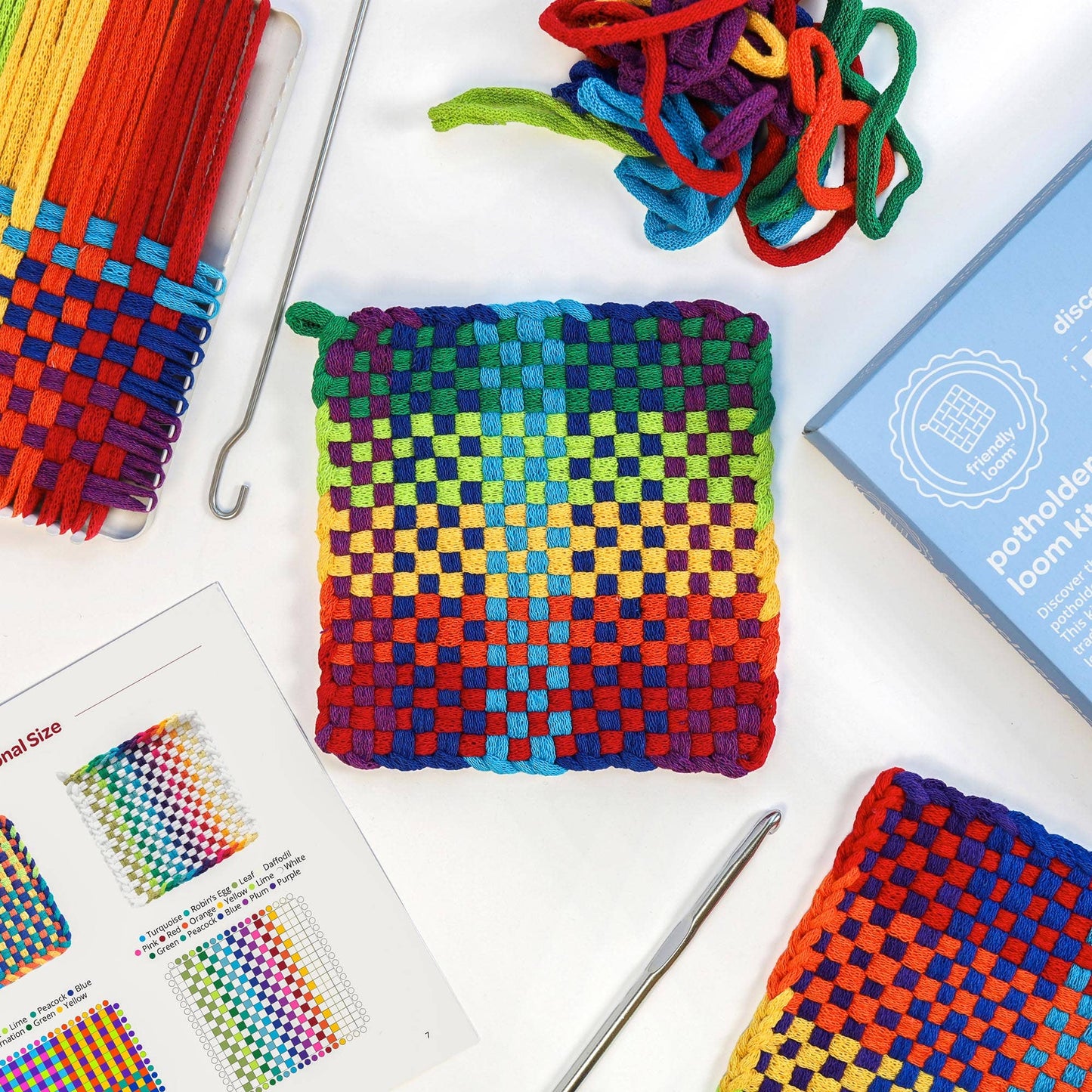 Finished colorful cotton potholders woven on the Traditional 7 inch Friendly Loom potholder loom