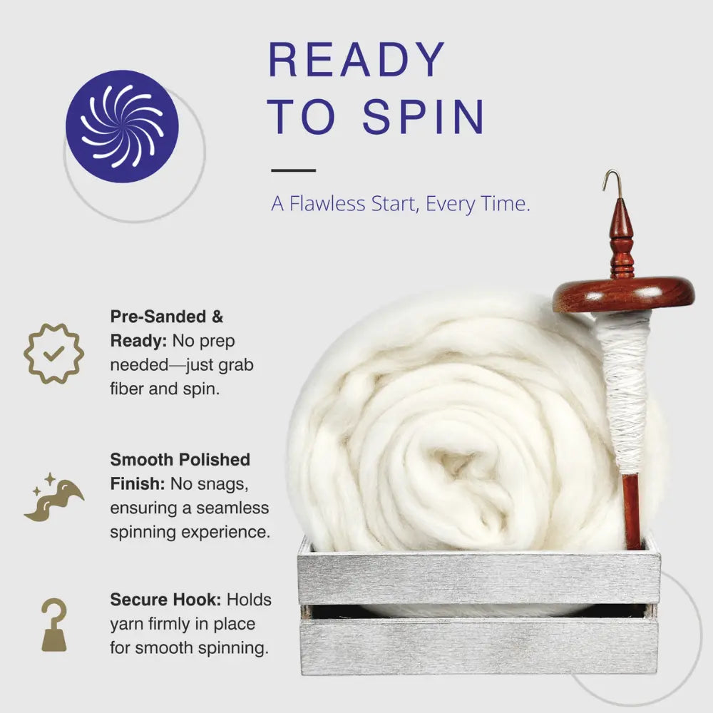 Wooden top whorl drop spindle with white yarn on a white background