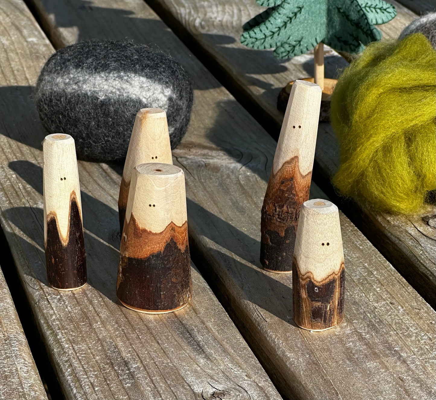 Natural wood Tree People figures used outdoors for open-ended small-world play