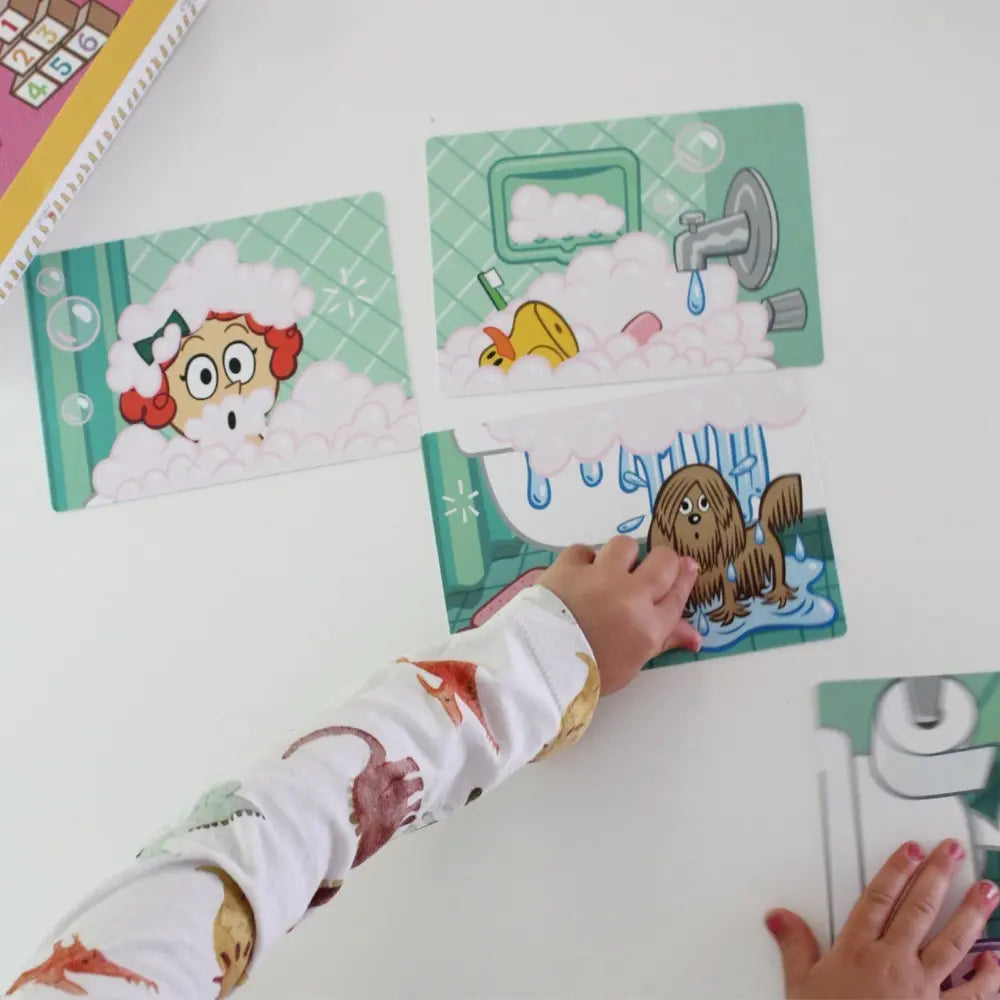 Children's educational cards about bathroom activities on a white surface.
