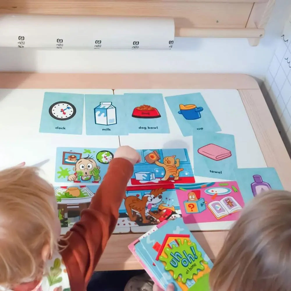 Children interacting with educational cards on a table