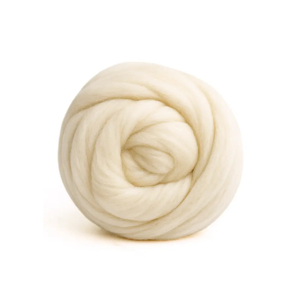 Ball of cream-colored Corriedale wool on a white background