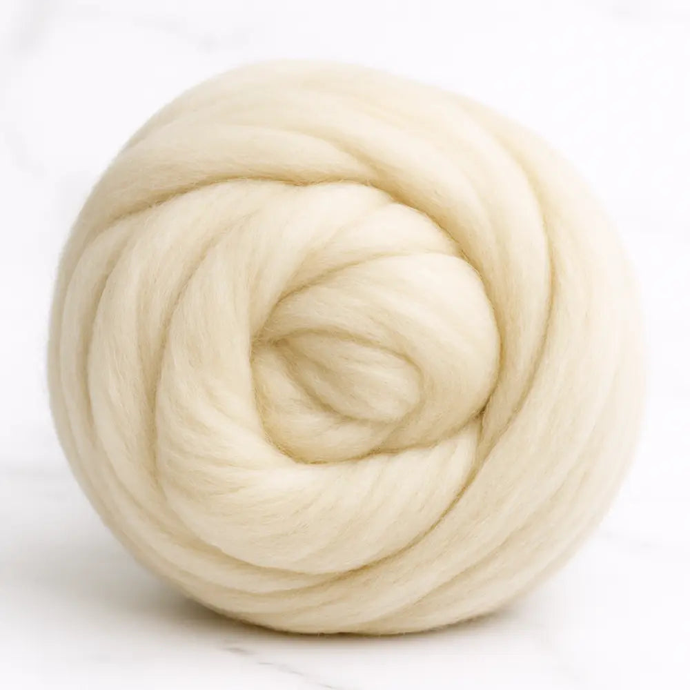 Ball of beige wool on a white background