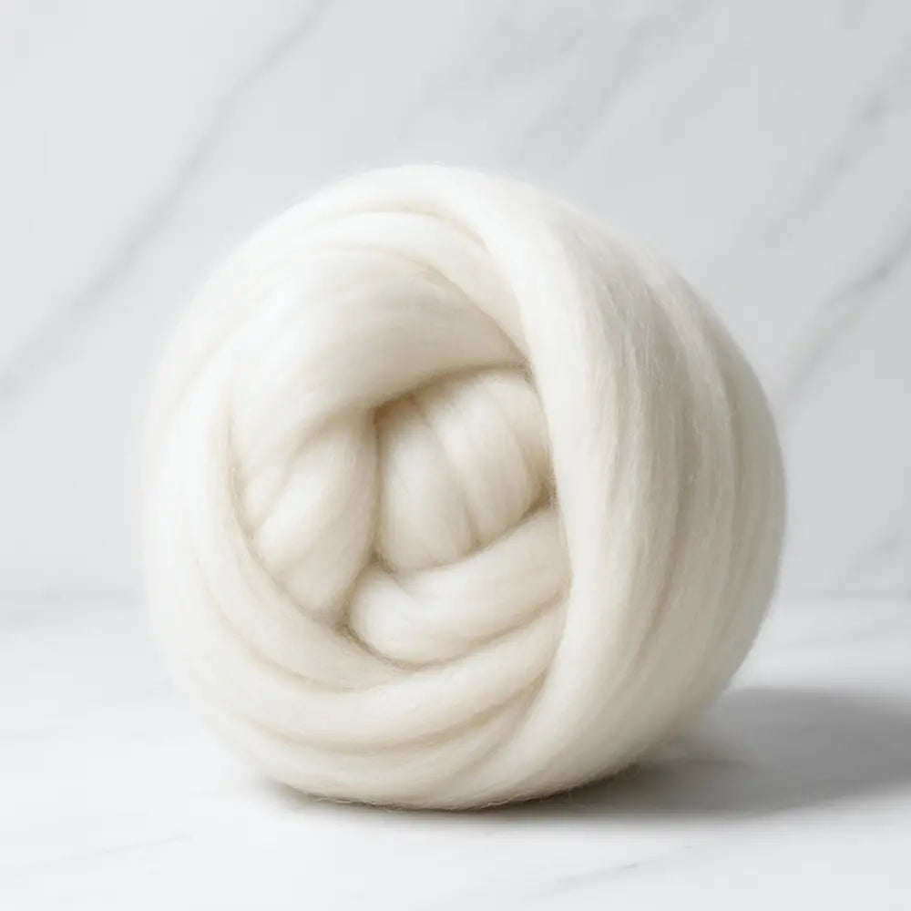 Undyed Merino wool combed top rolled up into a ball