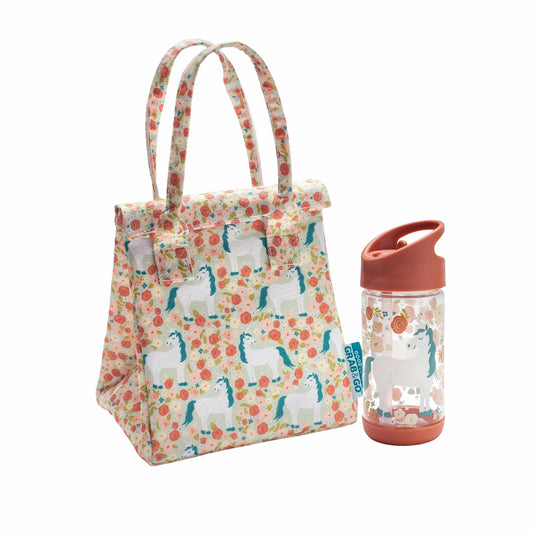 Floral-patterned lunch bag with unicorn design next to a clear water bottle with a pink lid on a white background