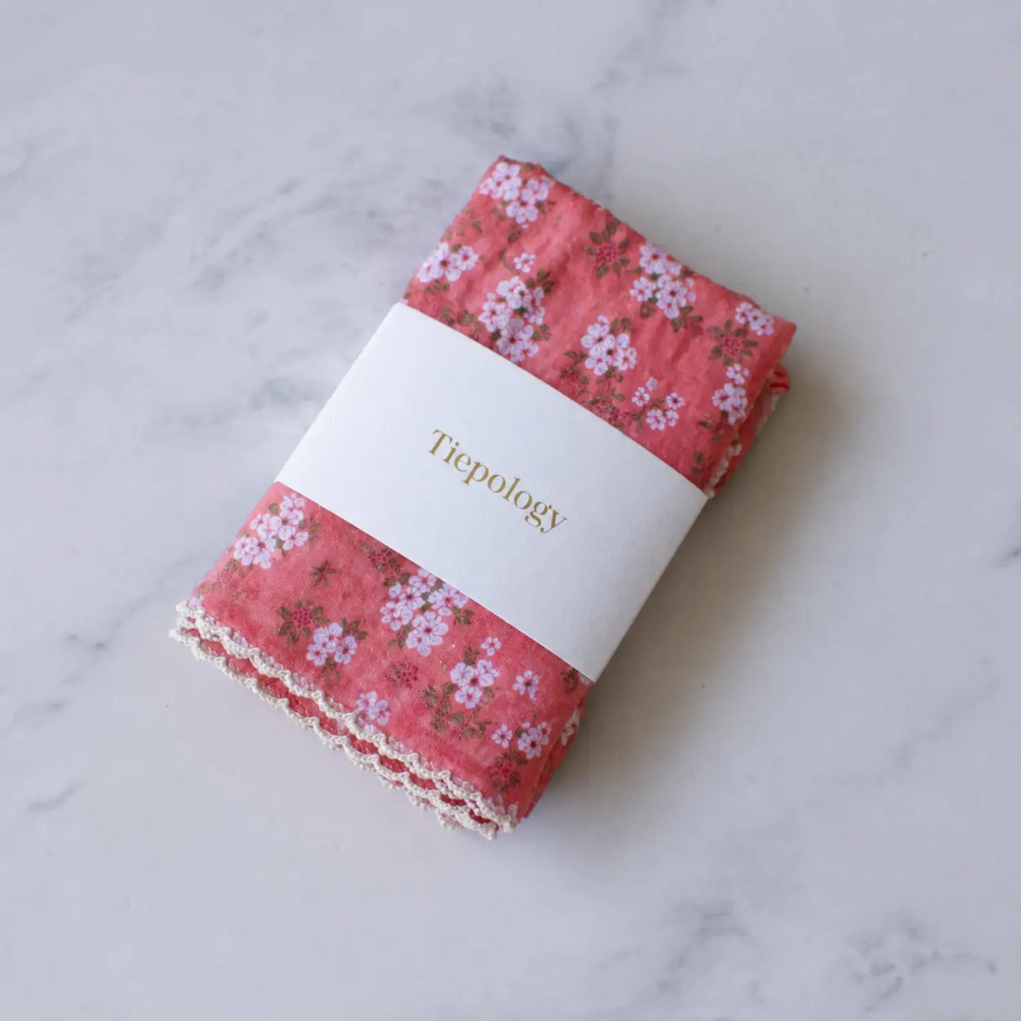 Folded Vintage Floral cotton blend square scarf by Tiepology in a coral floral print with light decorative edging