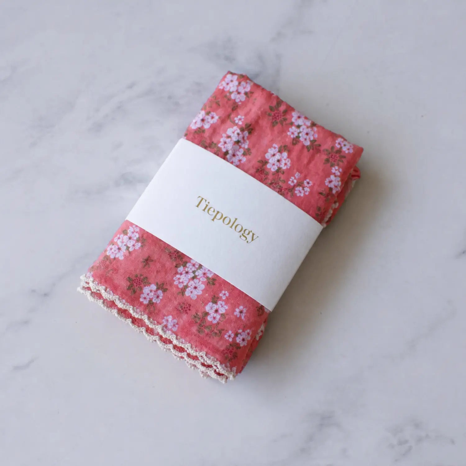 Folded Vintage Floral cotton blend square scarf by Tiepology in a coral floral print with light decorative edging