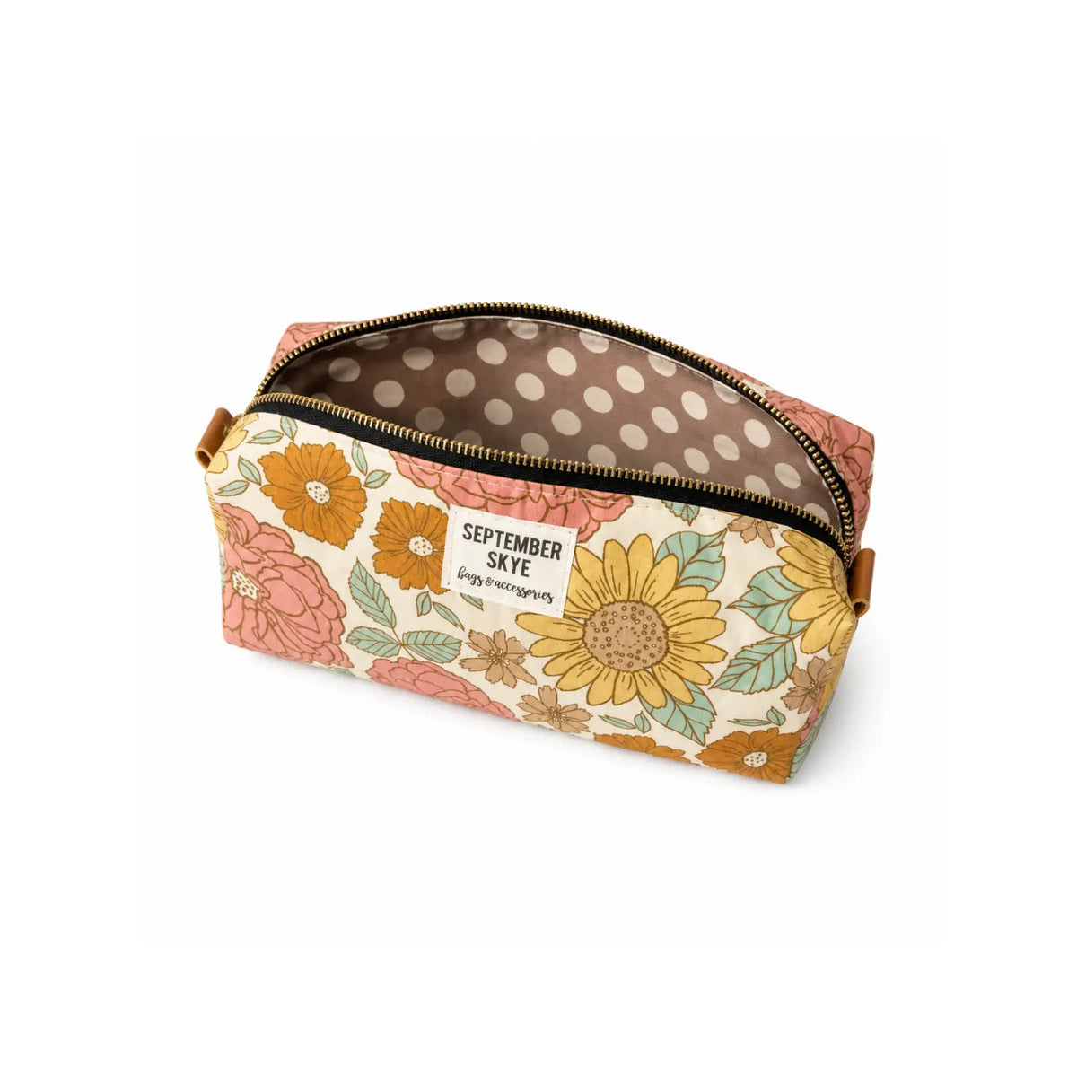 A boxy pencil pouch bag with vintage floral exterior and taupe and cream polka dot interior