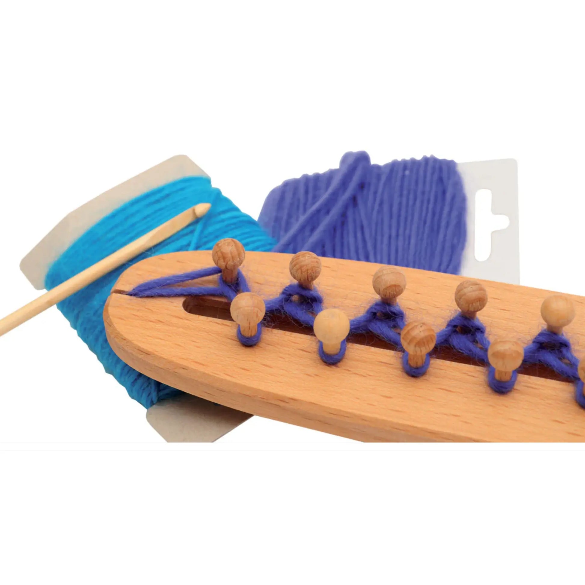 Wooden knitting tool close up with blue yarn and wooden needles on a white background