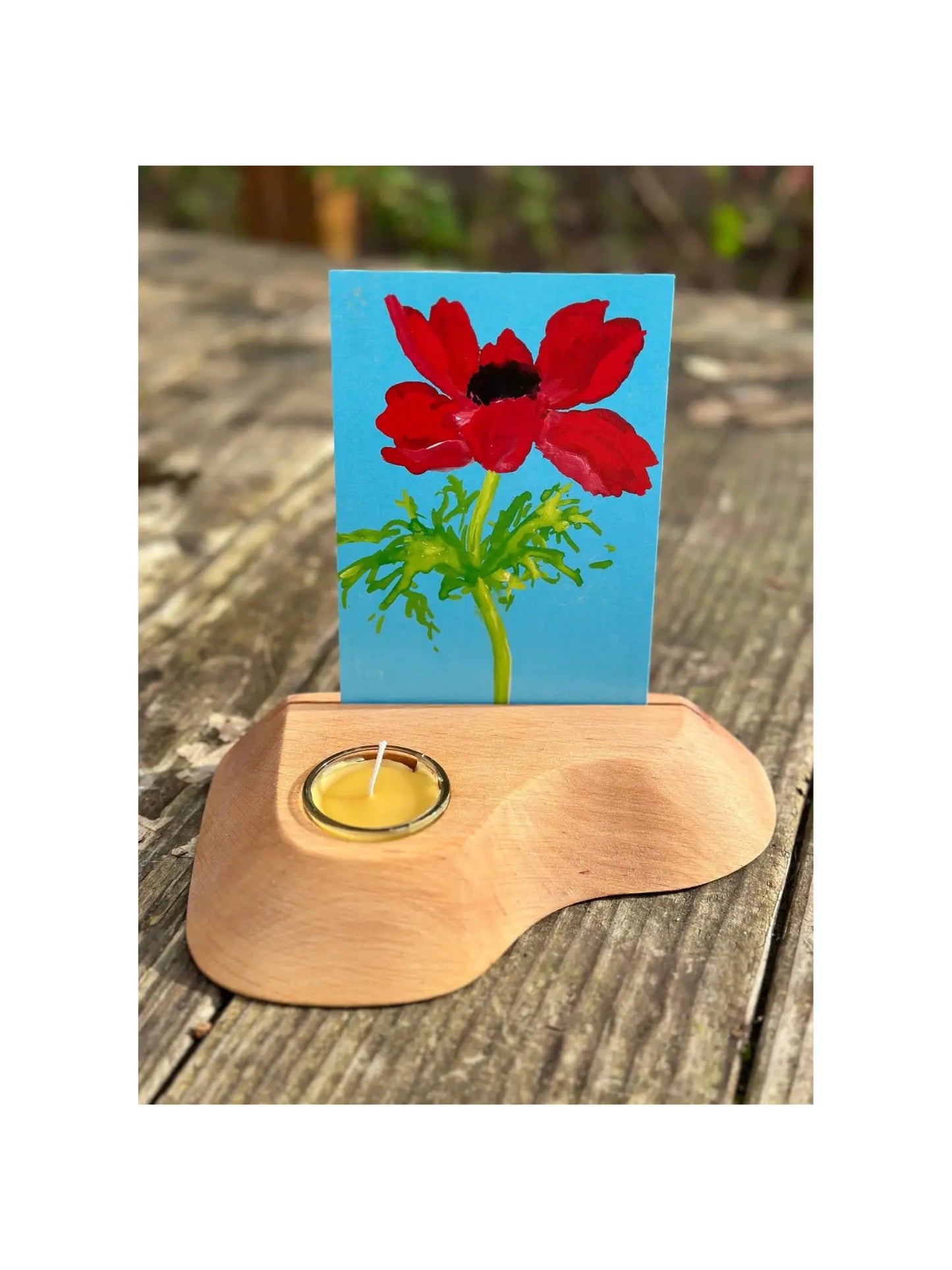 Alderwood Photo and Postcard Holder with Tealight and a postcard of cosmo flowers on rustic outdoor wooden table