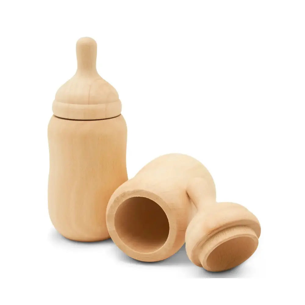 Wooden baby bottle and nipple on a white background