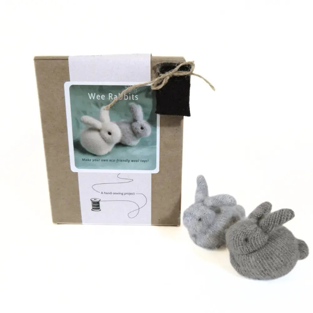 Knitted rabbit toys with packaging and label on a white background