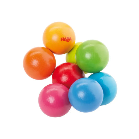 Colorful wooden baby toy with HABA logo on a white background